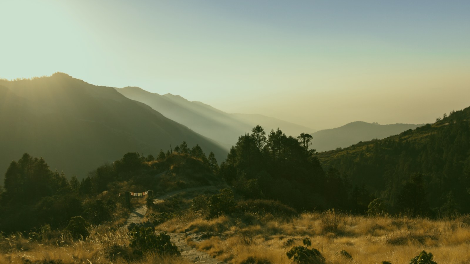 Golden morning light over distant hills
